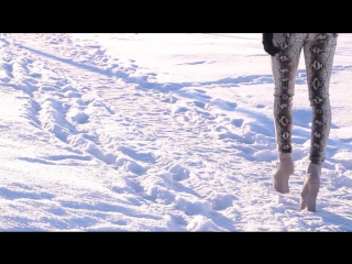 heel-less glossy boots in the snow crushing and playing snow crunchtrailer